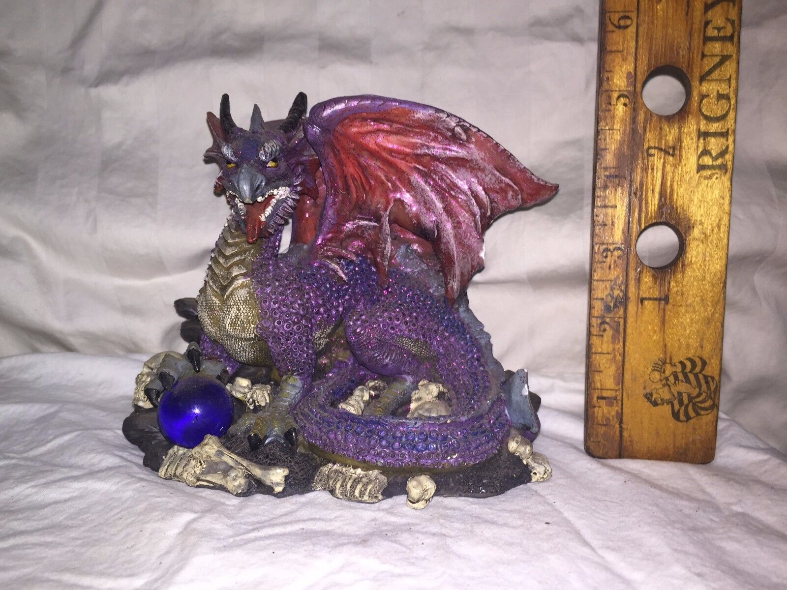 WINGED DRAGON FIGURINE, Purple Dragon on Rocks and skeletons, Acrylic & Resin